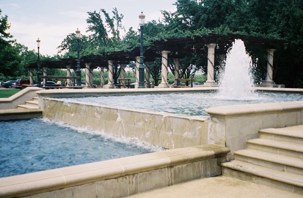 Splashing fountain and reflecting pool in front of the columned pergola at the Inglenook estate in Rutherford