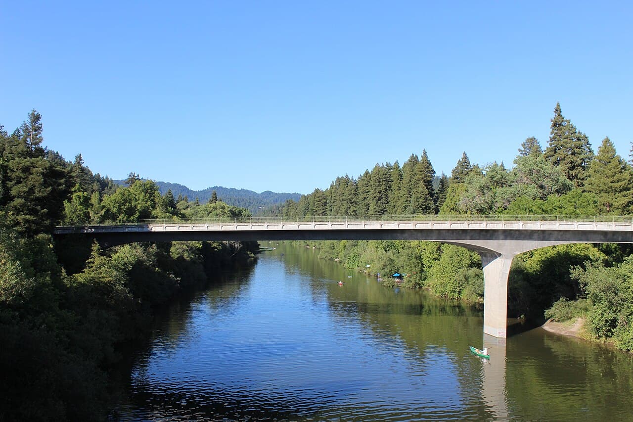 Calm stretch of the Russian River below the Highway 116 bridge at Guerneville on a clear day
