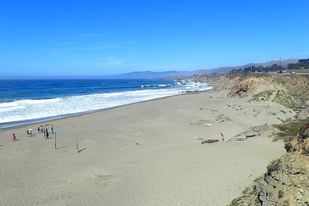 Wide sandy beach, surf and bluffs at North Salmon Creek Beach in Sonoma Coast State Park