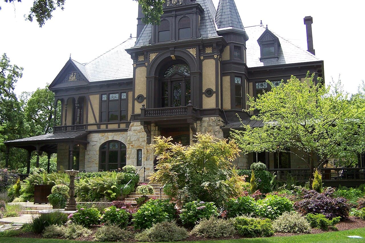 The ornate 1880s Rhine House mansion behind lush flowering gardens at Beringer Vineyards in St. Helena